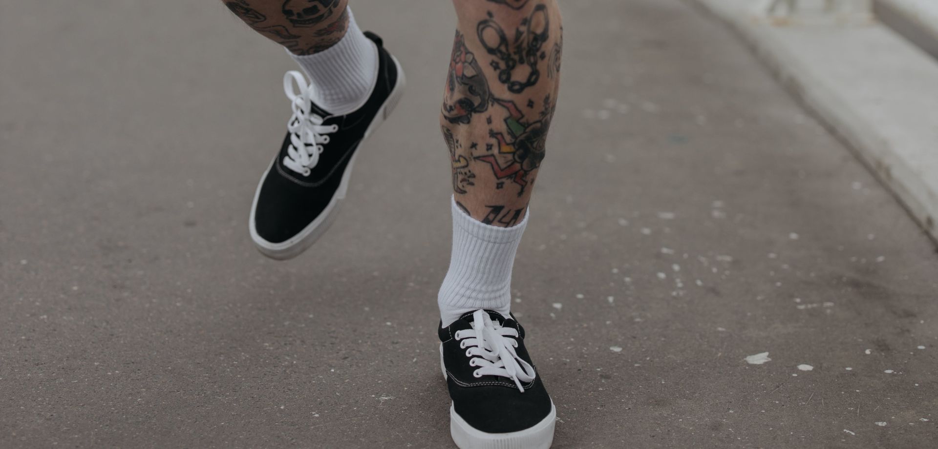 A Person in Black and White Sneakers